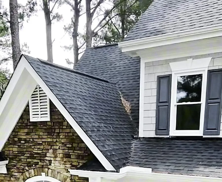 Shingle roof and white trim on a home